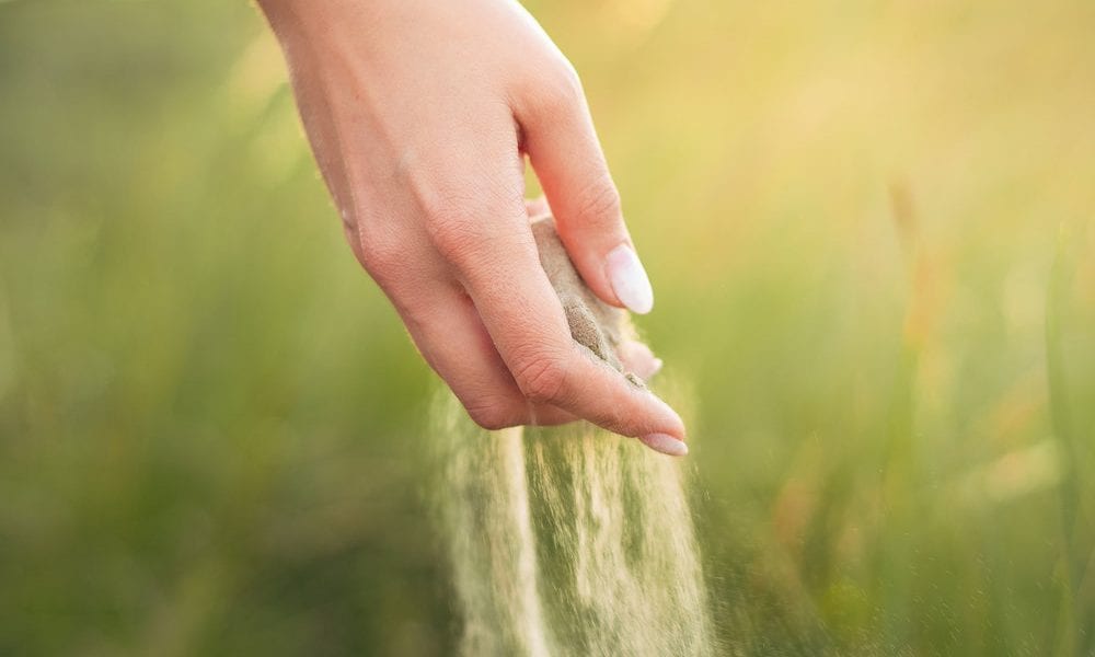 Hand releasing Sand